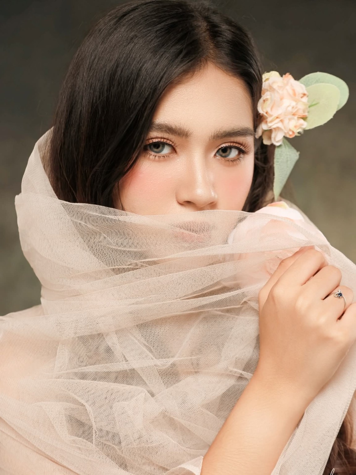 Editorial portrait with sheer fabric